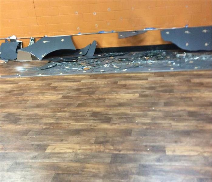 Gym with broken mirrors on the floor