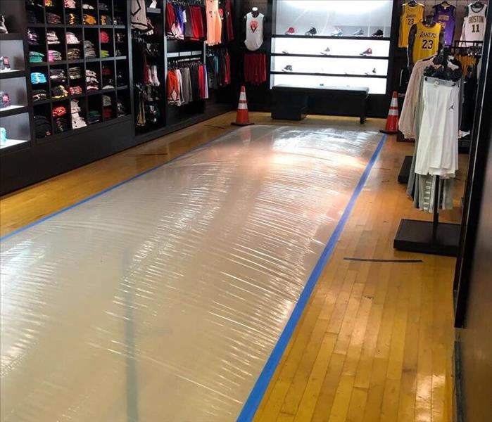 Shop flooring with plastic over a section