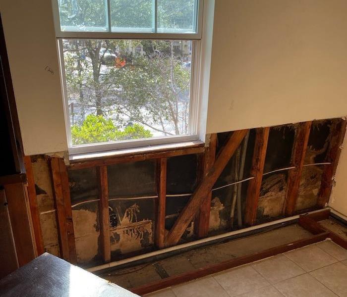 Wall with sheetrock cut away under a window