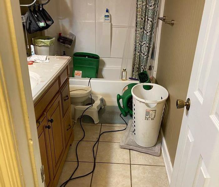 Bathroom with SERVPRO drying equipment