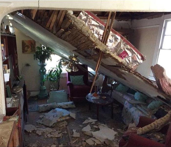 Room with collapsed ceiling and debris