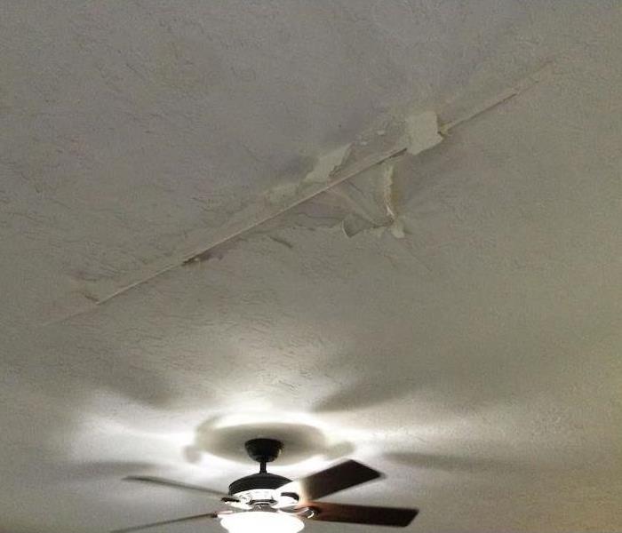Ceiling with visible water damage 
