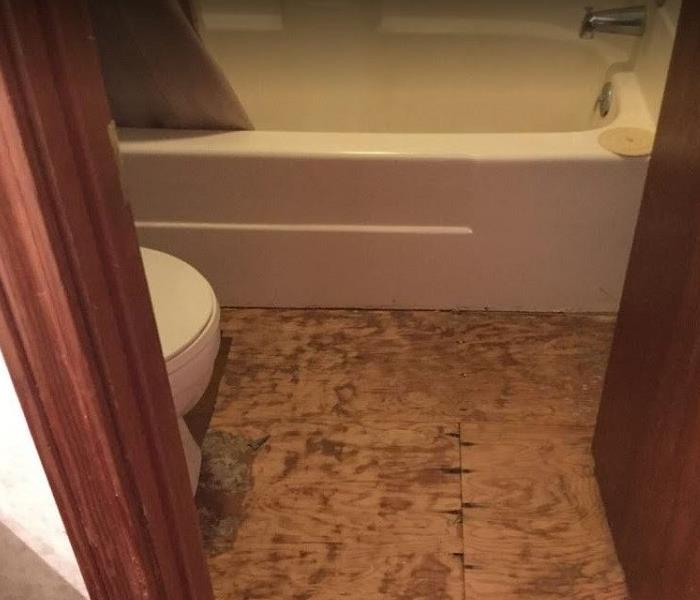 Flooring removed from water damaged bathroom