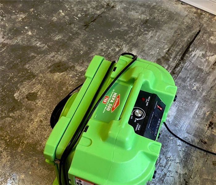 a SERVPRO appliance working in a room