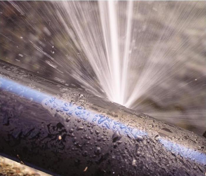 water spewing from pipe