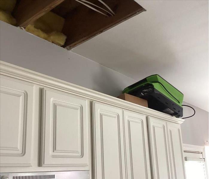 demo ceiling over kitchen cabinets, dryer close by